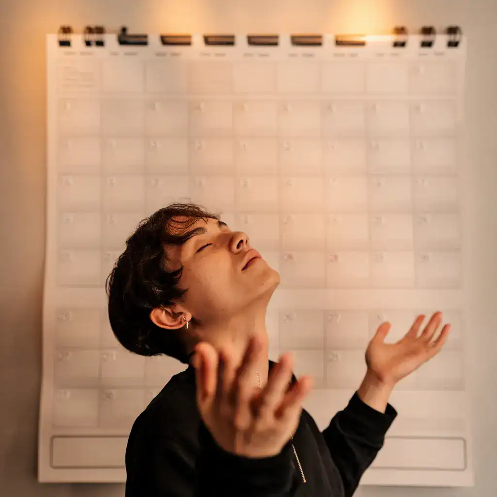 person in front of calendar enjoying freedom